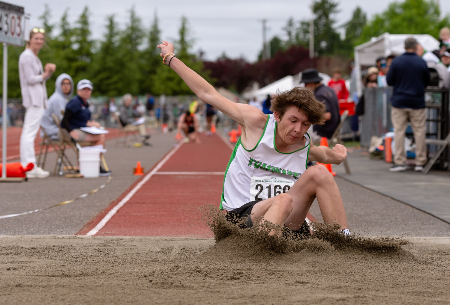 Tumwater’s Aaron Paul hits the dirt during an attempt in the 2A boys long jump at the WIAA 2A/3A/4A State Track and Field Championships on Saturday, May 27, 2023, at Mount Tahoma High School in Tacoma. (Joshua Hart/For The Chronicle)